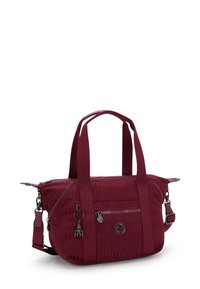 Burgundy nylon handbag with dual short handles and detachable shoulder strap. Features two zippered compartments and a textured surface.