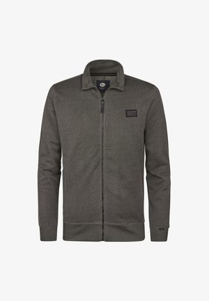 Giacca grigia con zip, colletto alto, polsini e fondo a costine. Presenta una patch del logo in tessuto sul petto e una maglia strutturata.