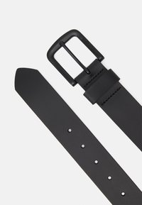 Black leather belt with a matte rectangular buckle, featuring a smooth texture, tapered end, and evenly spaced holes for adjustment.