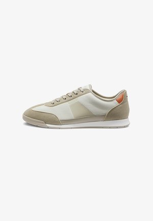 Beige and light brown low-top sneaker with mesh and suede panels, lace-up front, and subtle logo on side.