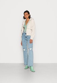 ONLY ONLJUICY WIDE LEG - Wide leg - light blue denim