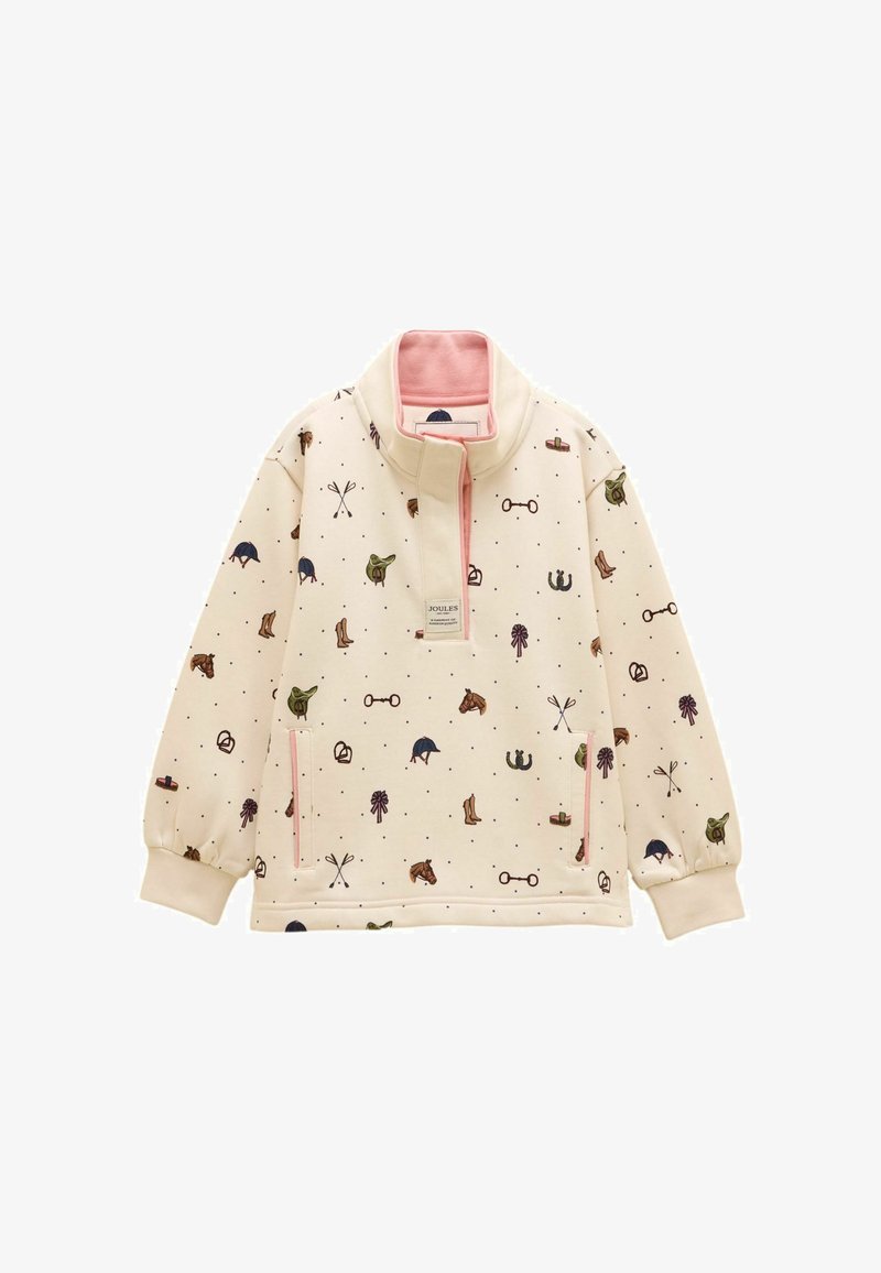 Pull-over crème avec doublure de col rose, présentant des icônes à thème équestre telles que bottes, casques, fers à cheval et selles, ainsi que des poches zippées à l'avant.