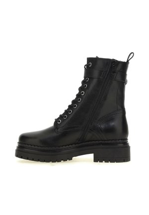 Botte de combat en cuir noir avec semelle crantée épaisse, fermeture éclair latérale, laçage à l'avant, bride à la cheville et languette de tirage à l'arrière.