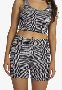 Black and white striped crop top and shorts set, featuring a square neckline, sleeveless design, textured fabric, and a relaxed fit.