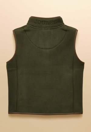 Tummanvihreä hihaton fleeceliivi, jossa on korkea kaulus ja "JOULES" kirjailtuna takakaulukselle, koristeltu ruskealla reunuksella.