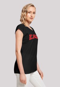 F4NT4STIC DISNEY HIGH SCHOOL MUSICAL EAST - Camiseta estampada - black
