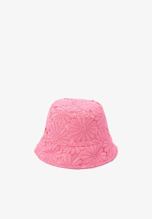Pink bucket hat made of textured fabric, featuring a floral pattern with raised stitching. Rounded shape with a wide, flexible brim.