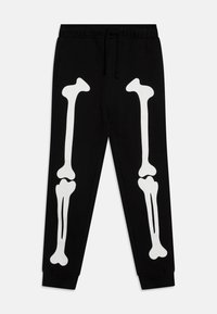 Black sweatpants with a white bone graphic print on each leg. Elastic waistband with drawstring and ribbed cuffs. Soft fabric texture.