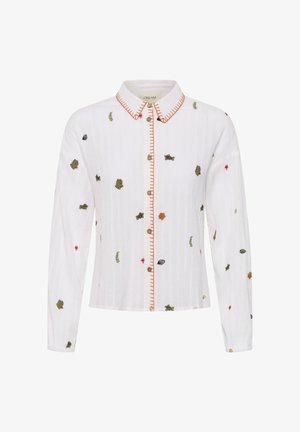 Witte blouse met lange mouwen en knopen, met een kraag en knopenlijst met oranje stiksels, voorzien van kleine meerkleurige geborduurde bloemen en bladeren.