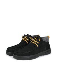 Black suede ankle shoes with gray fabric lining, yellow laces, and black rubber soles. Features stitching and a rear pull tab.