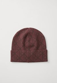 Maroon knit beanie with patterned dark brown geometric designs. Features a wide folded cuff and a soft, textured finish.