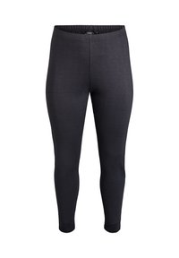 Los leggings negros cuentan con una tela texturizada, una cinturilla elástica y una forma ajustada, diseñados para la comodidad y la libertad de movimiento.