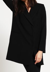 Sisley Kort kappa / rock - black