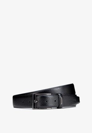 Ceinture en cuir noir texturé avec boucle rectangulaire argentée et nom de marque embossé "Wittchen" sur la boucle et la pointe.
