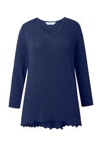 Navy blue koszula z długim rękawem, z dekoltem w serek, lekko rozszerzonym dołem z falbanką i luźnym krojem.
