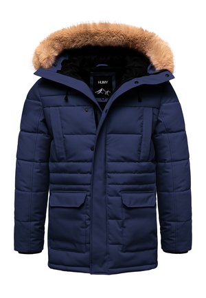 Marineblaue Steppjacke mit einer gefälschten, fellgefütterten Kapuze, horizontaler Steppung, zwei Fronttaschen und einem schwarzen Innenfutter.