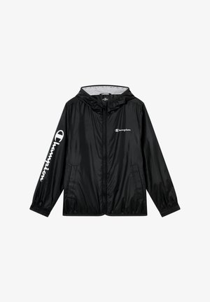 Giacca a vento nera, leggera, con cappuccio. Presenta polsini elasticizzati, due tasche laterali e dettagli del logo "Champion" sulla manica e sul petto.