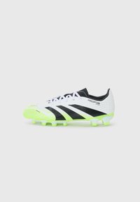 White synthetic soccer cleat with black accents and neon green sole. Features textured upper, lace closure, and Predator branding.