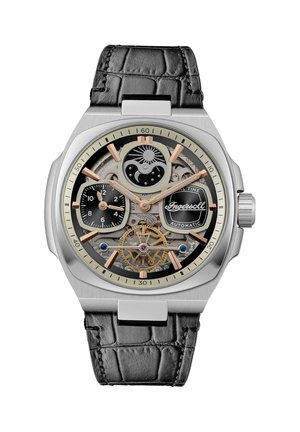 Montre automatique avec boîtier en acier inoxydable, bracelet en cuir de crocodile noir, accents argent et or, cadran transparent révélant une mécanique complexe.