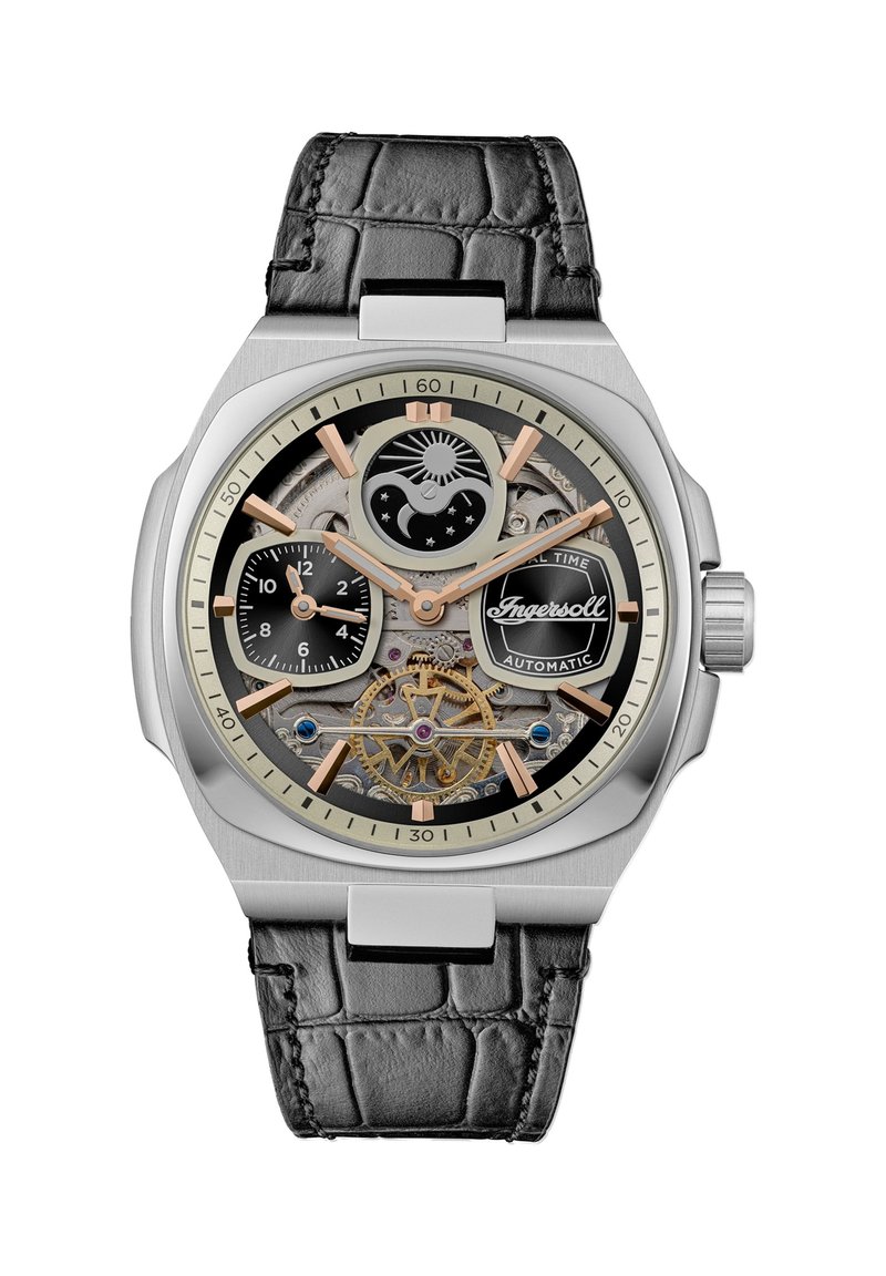 Automatisch horloge met een kast van roestvrij staal, zwarte krokodillenleren band, zilveren en gouden accenten, en een transparante wijzerplaat die ingewikkelde mechanismen onthult.