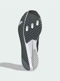 Čierna a sivá podrážka tenisky s textúrovanou gumou, tromi viditeľnými vzduchovými vreckami a štíhlym dizajnom s tvarovanými detailmi.