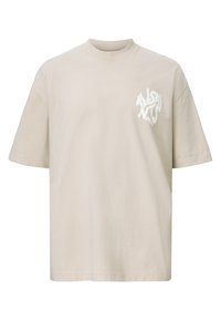 Beige oversized short-sleeve T-shirt with white abstract text logo on the left chest area.