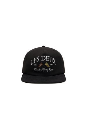 Black cap with flat brim, featuring white embroidered text: "LES DEUX EST. 2011" and "International Sporting Goods." Smooth fabric texture.