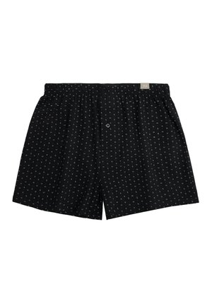 Boxer negros de hombre con pequeños patrones de rayas verticales en blanco y gris y una cintura elástica con una pequeña etiqueta de la marca.