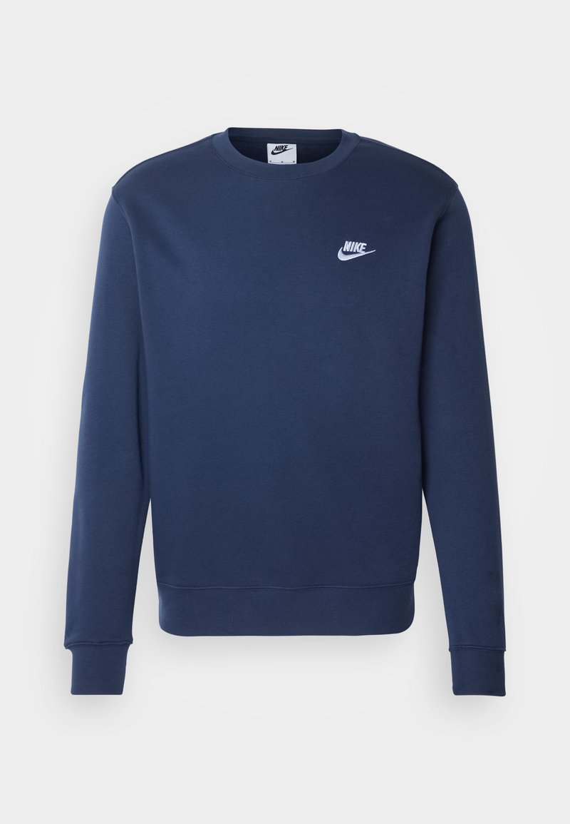 Mörkblå Nike-tröja med lång ärm, ribbade muddar och nederkant, rund halsringning och vitt logo på bröstet. Tillverkad av mjukt tyg.