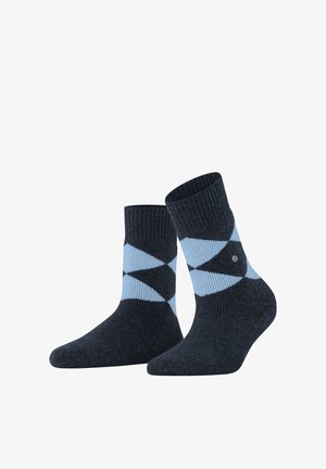 Calze blu scuro con un motivo argyle blu chiaro e nero, bordino a coste e un discreto logo sui lati. Texture morbida.