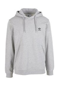 Sivika kapuca iz mešanice bombaža, z kengurujem na sprednji strani, kapuco z vrvico in črnimi Adidasovimi logo na prsih.