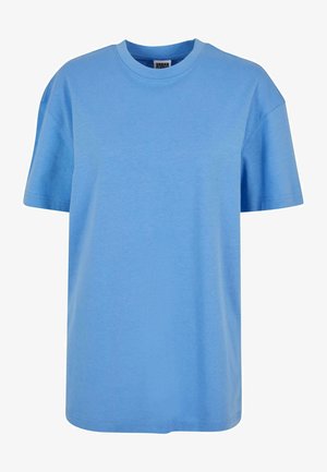 T-shirt di cotone azzurro chiaro con maniche corte, collo a giro e vestibilità rilassata. Il tessuto appare morbido, senza motivi o design visibili.