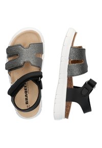 Sorte og sølv sandaler med en korksål, hvid gummisål og justerbar rem. Har strukturerede remme og udsnit design.