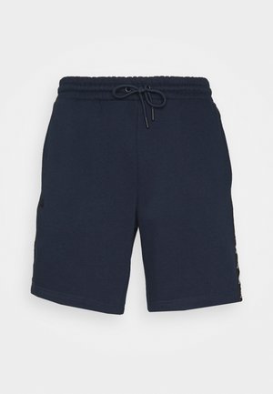 Marineblå afslappede shorts med elastisk talje og snøre foran, lavet af blødt stof.