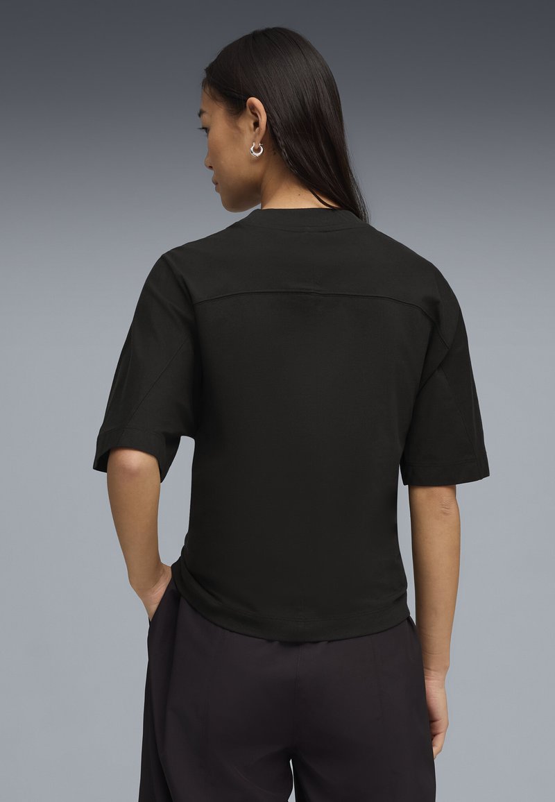 Puma DARE TO FITTED WAIST TEE - Jednoduché tričko - black
