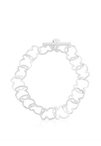 Pulsera de plata con un diseño ondulado y enlazado de forma irregular. Cerrada con un broche de palanca. Acabado de alto brillo, textura suave.