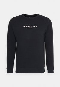 Felpa nera con scollo rotondo, maniche lunghe raglan e logo bianco in rilievo "REPLAY EST.1981" sul petto.
