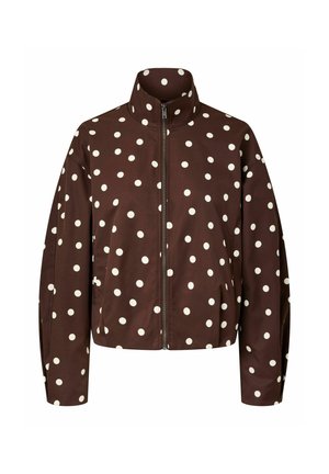 Brun zip-up jakke med hvite polkadotter, høy krage og lange ermer, vist på hvit bakgrunn.