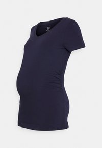 T-shirt de maternidade em algodão elástico, com mangas curtas, decote em V profundo e franzido lateral para um ajuste ajustado à volta da barriga.