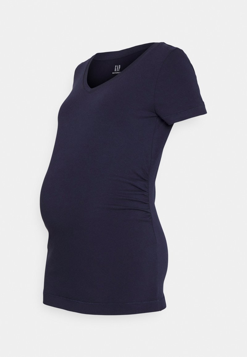 T-shirt de maternidade em algodão elástico, com mangas curtas, decote em V profundo e franzido lateral para um ajuste ajustado à volta da barriga.