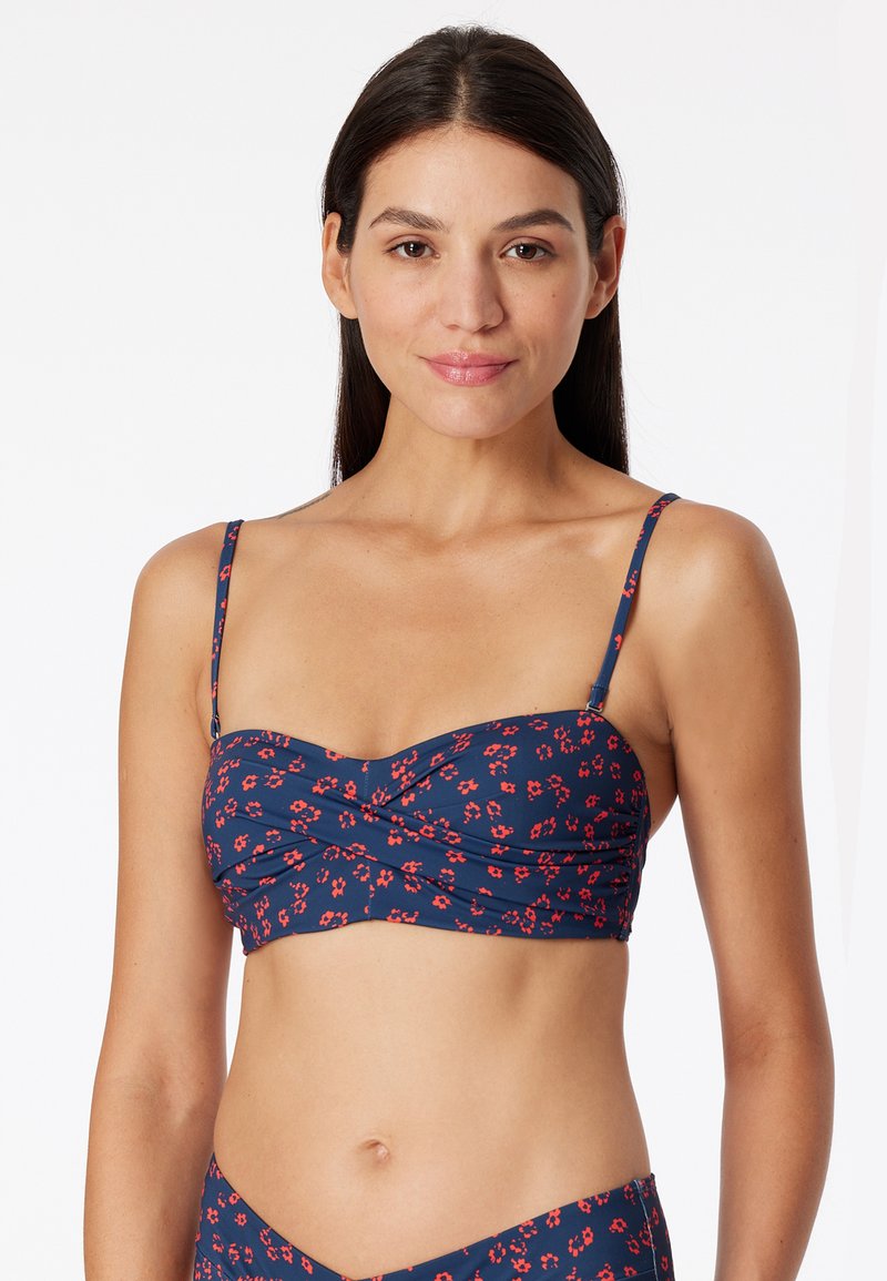 Marine bikini top met bloemenpatroon, verstelbare banden, geplooid ontwerp en een aansluitende pasvorm. Gemaakt van lichtgewicht stretchmateriaal.