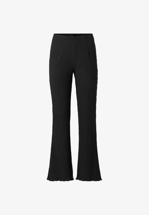 Sorte teksturerede bukser med en svag vidde ved benenden, der har en tætsiddende talje og et glat, sømfrit design.