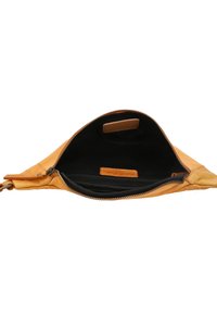 Tan leather bag with a zip closure, featuring a black fabric interior and a small zipped pocket. Minimalist design with smooth texture.
