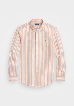 Striped long-sleeve shirt in pastel orange, blue, and white; button-down collar; curved hem; embroidered logo on left chest; cotton material.