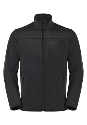 Musta softshell-takki, jossa on kokopitkä vetoketju edessä, korkea kaulus, vetoketjulliset sivutaskut ja hillitty logo rinnassa.