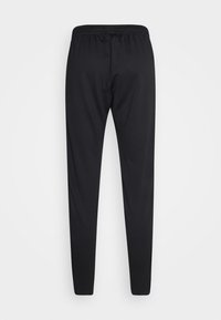 Pantalon de sport noir fuselé avec taille élastique, affiché à plat sur un fond blanc, montrant le dos.