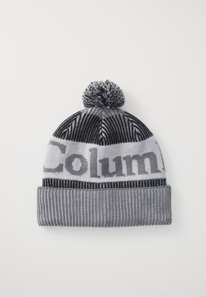 Knitted beanie in black, gray, and white. Features a pom-pom, ribbed texture, and a prominent logo text band towards the center.