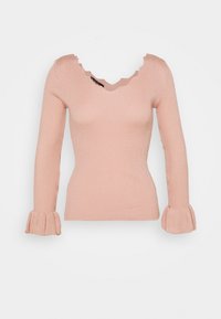 Rippendes, langärmliges Oberteil in sanftem Rosa mit tiefem V-Ausschnitt und gewelltem Kragen. Der körpernahe Schnitt und die ausgestellten Ärmel sorgen für Textur im Design.