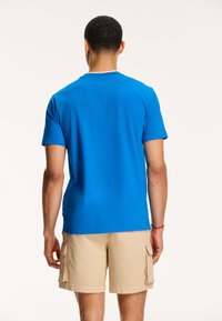 Shiwi Triko s potiskem - skydive blue