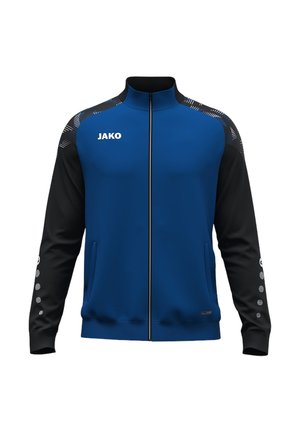 Veste de sport zippée bleu et noir avec logo blanc JAKO sur la poitrine, bandes à motifs sur les épaules et sept boutons ronds sur chaque manche.